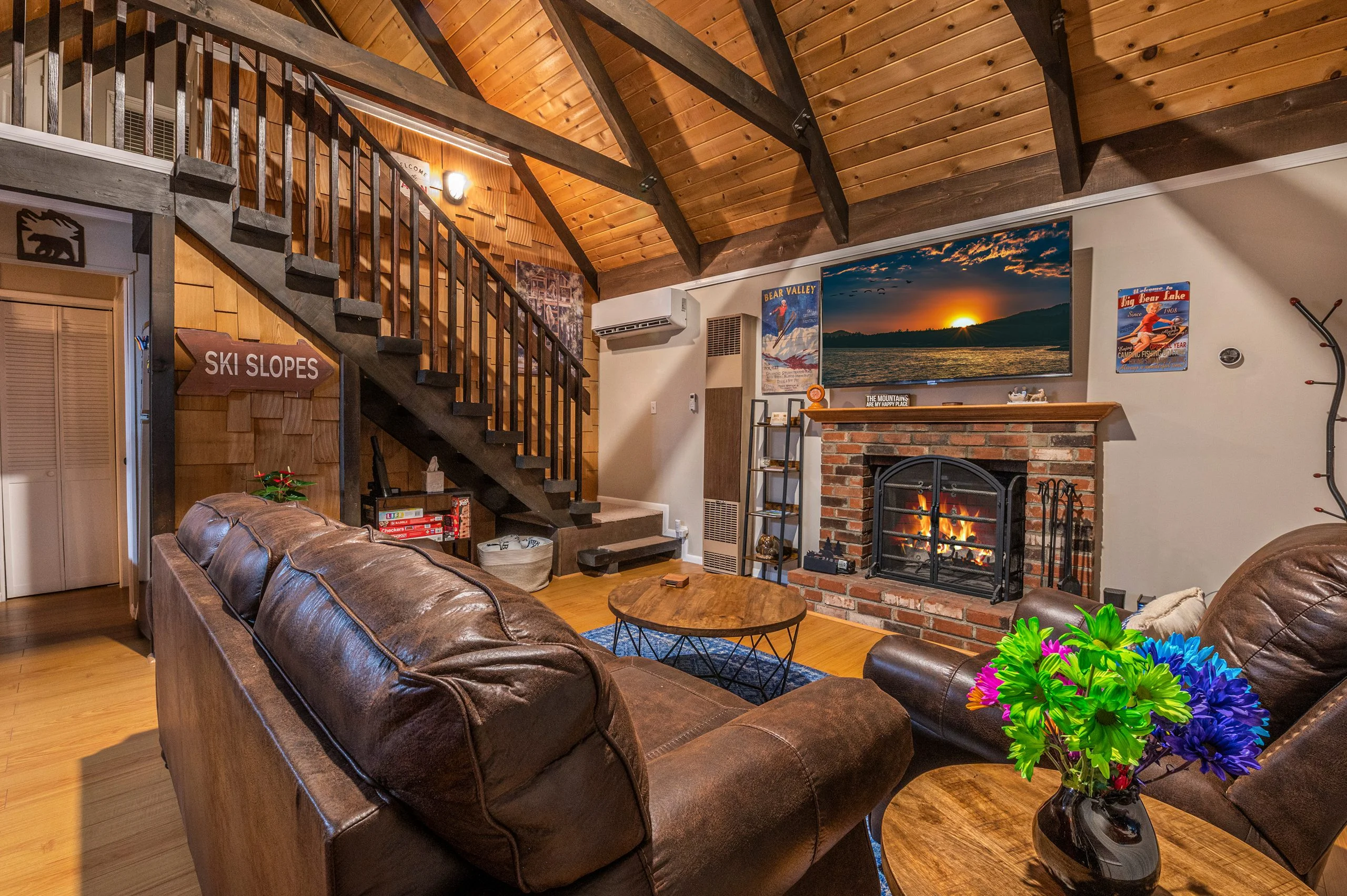 Enjoy your favorite movie on the 65" inch fully loaded TV while enjoying the cozy wood burning fireplace.